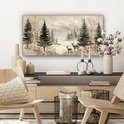 Paysage forestier hivernal avec deux cerfs et des accents dorés, suspendu au-dessus d'un meuble.