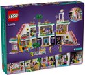 Arrière de la boîte de LEGO Friends Centre Commercial avec 6 mini-poupées, un chariot à glaces et 2 toboggans. À partir de 8 ans.