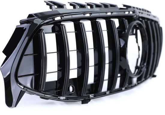 Glanzend zwarte grille met verticale spijlen en een ronde opening in het midden.