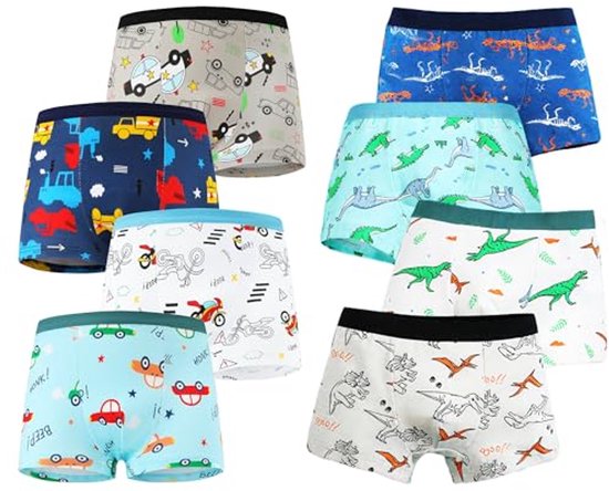 Acht jongens boxershorts met prints van dinosaurussen, auto's en vrachtwagens in diverse kleuren. Er zijn grijze, blauwe, witte en lichtblauwe ondergronden.