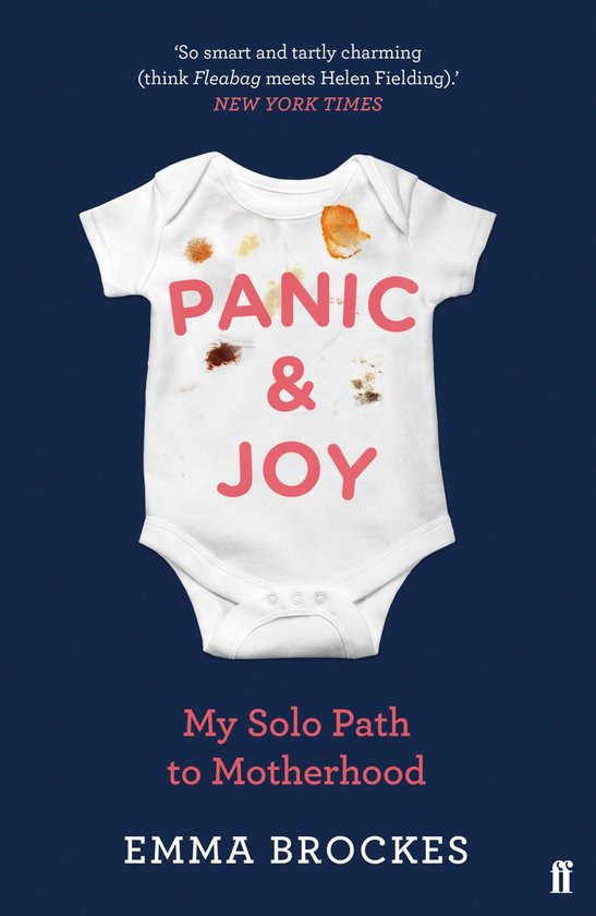 Body blanc pour bébé avec le texte 'PANIC & JOY' en lettres roses. Taches sur le devant.