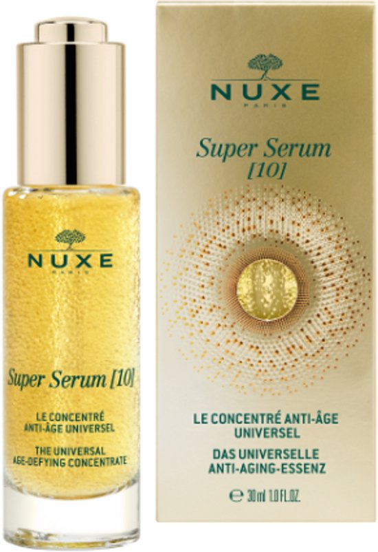Nuxe Super Serum [10] anti-age serum in glazen flesje met gouden dop, naast de bijpassende gouden verpakking.