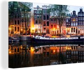Canvas Schilderij Grachtenpanden in Amsterdam tijdens de avond - 120x80 cm - Wanddecoratie