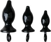 Zwarte trainingsset met drie buttplugs