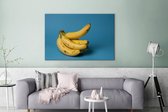 Canvas Schilderij Banaan - Fruit - Blauw - 120x80 cm - Wanddecoratie