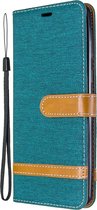 Mobigear Telefoonhoesje geschikt voor Samsung Galaxy A21 Hoesje Stof | Mobigear Fabric Bookcase Portemonnee | Pasjeshouder voor 2 Pasjes | Telefoonhoesje voor Pinpas / OV Kaart / Rijbewijs - Groen