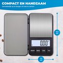 Balance numérique compacte avec couvercle ouvert, affichage 0,00g. Dimensions 12,3 x 7,3 cm.