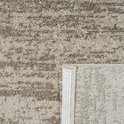 Tapis beige avec un motif abstrait, le dos est visible.