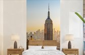 Behang - Fotobehang Zonsondergang skyline van New York met het Empire State Building - Breedte 120 cm x hoogte 240 cm