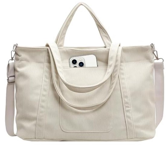 Sac fourre-tout en velours côtelé blanc cassé avec une poche avant pouvant contenir un smartphone. Bandoulière réglable.