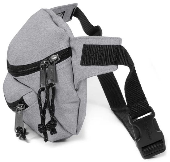 Vue latérale d'un sac banane Eastpak gris avec sangle réglable et boucle.