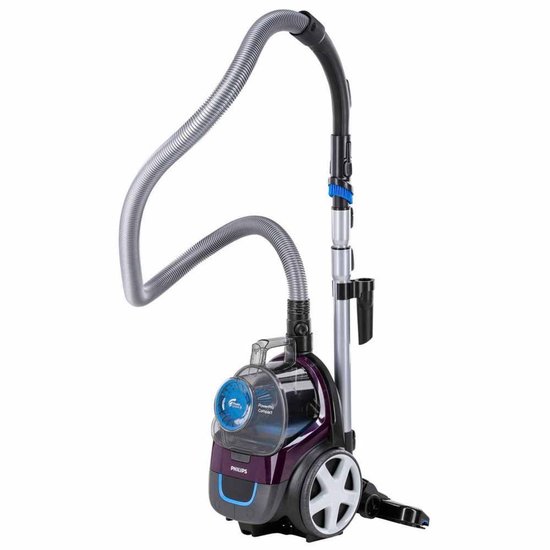 Aspirateur violet Philips avec tuyau et manche, debout sur fond blanc.