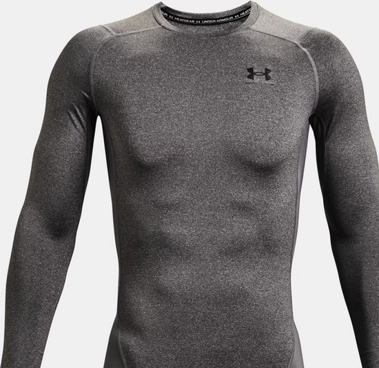 Heren sportshirt van Under Armour in Carbon Heather grijze melange. Langere mouwen en ronde hals.