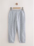Lichtgrijze joggingbroek met elastische tailleband en zoom.