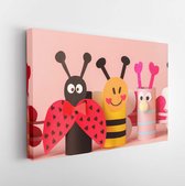 Paper toy insect for valentine romance baby shower, birthday party. Easy crafts for kids on pink background, copy space, die creative idea from toilet tube roll, recycle reuse eco