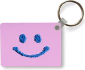 Sleutelhanger - Glimlachende smiley gemaakt van poeder - Uitdeelcadeautjes - Plastic