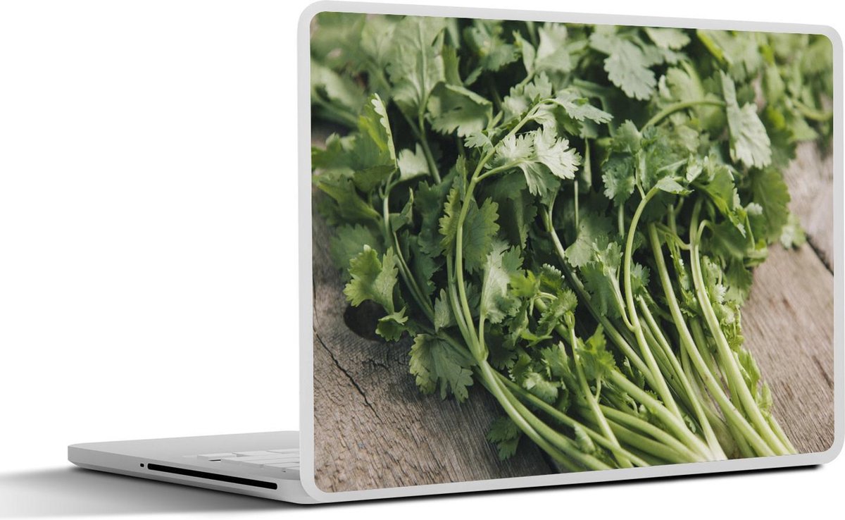 Afbeelding van product SleevesAndCases  Laptop sticker - 14 inch - De korianderstengels op een houten tafel