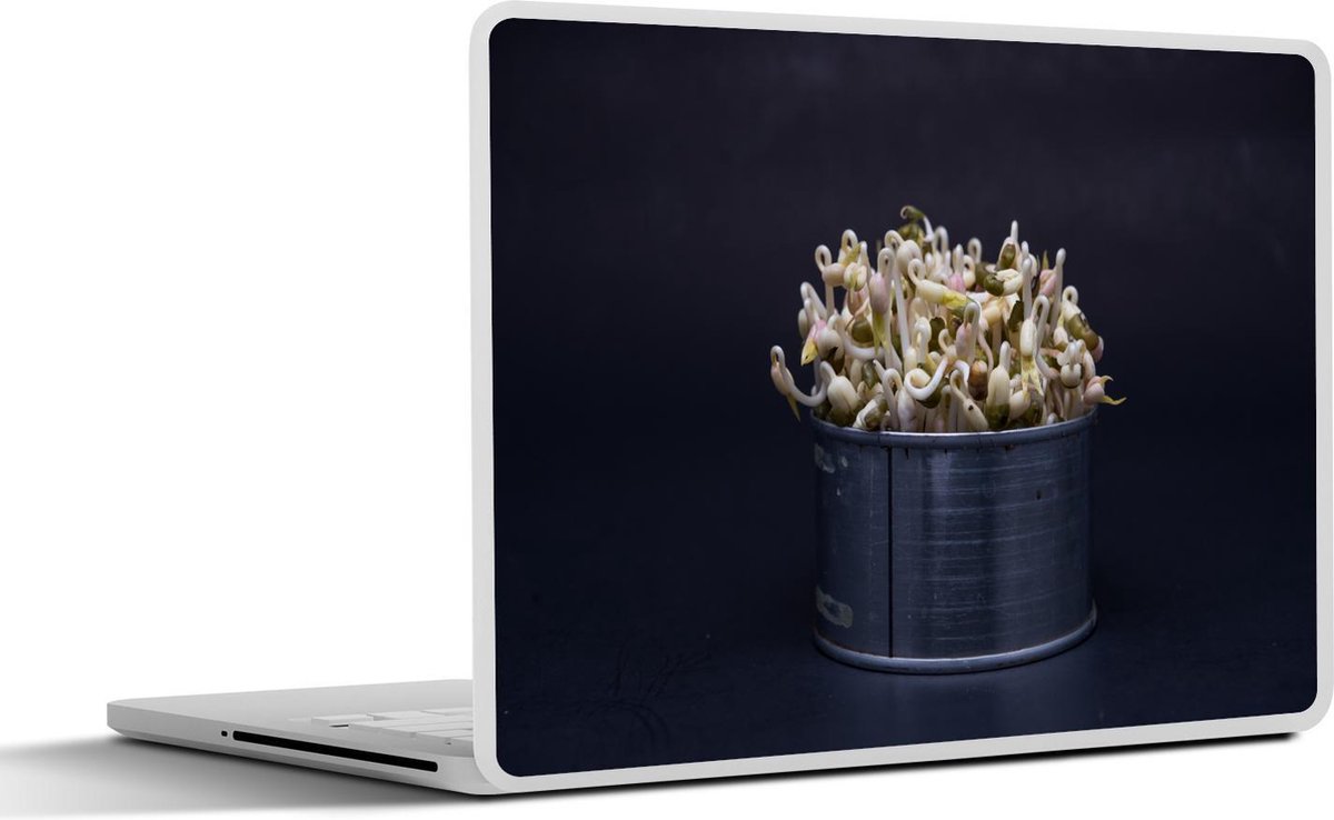 Afbeelding van product SleevesAndCases  Laptop sticker - 13.3 inch - Taugé in een metalen bakje op een zwarte achtergrond