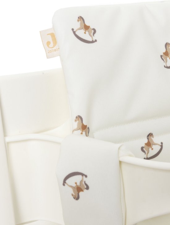 Witte stoelverkleiner met bruine wiebelpaardjes print. Jollein logo op een label.