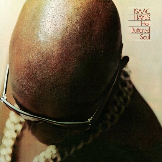 Albumhoes van Isaac Hayes - Hot Buttered Soul. Close-up van een hoofd met bril en gouden ketting.