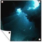 Tuinposters Vissen zwemmen in een grot met doorbrekend zonlicht bij de Grand Cayman - 50x50 cm - Tuindoek - Buitenposter