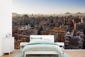 Behang - Fotobehang Skyline van de oude stad Sanaa in Jemen - Breedte 420 cm x hoogte 280 cm