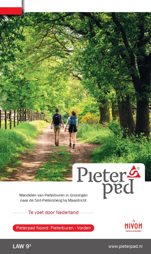 Kopperen van Pieterpad Noord: Pieterburen - Vorden. Twee wandelaars met rugzakken op een bospad.