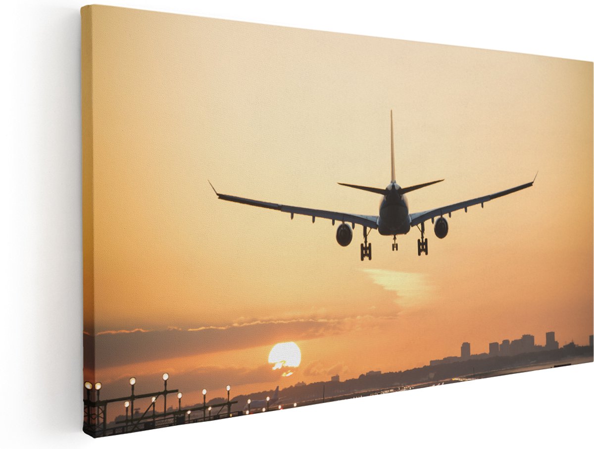 Artaza Canvas Schilderij Vliegtuig Landt Tijdens Zonsondergang - 180x90 cm - Groot - Wanddecoratie Woonkamer - Schilderijen - Muurdecoratie