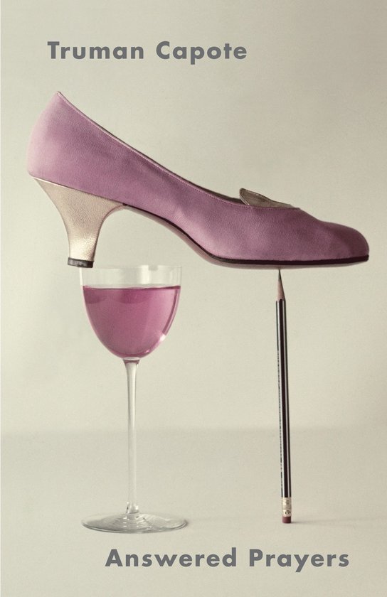 Lila pump met gouden hak balanceert op een potlood boven een glas roze vloeistof. Titel: Answered Prayers.