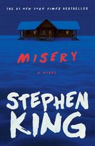 Boekcover 'Misery' van Stephen King, met een besneeuwd huis op de achtergrond.