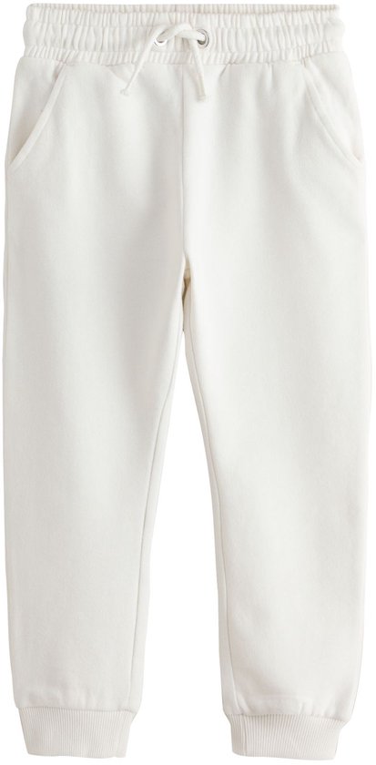 Gebroken witte joggingbroek met trekkoord, steekzakken en elastische boorden aan de enkels.
