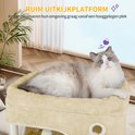 Beige kattenmand met dikke, zachte vacht. Een ragdollkat met blauwe ogen ligt comfortabel in de mand.