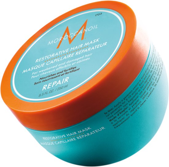 Moroccanoil Restorative Hair Mask in turquoise pot met oranje deksel.