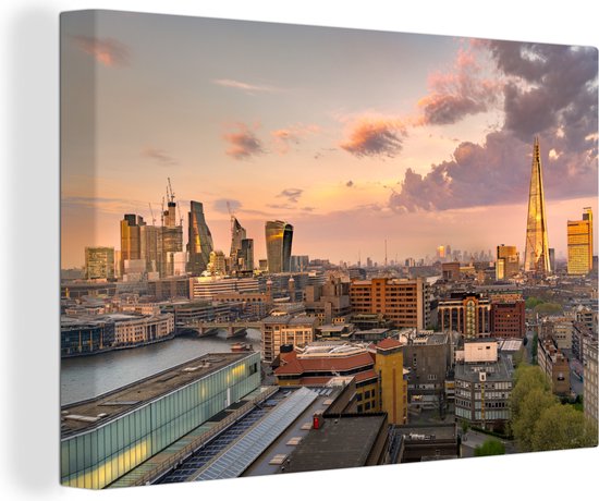 Canvas Schilderij De skyline van Londen met de Millennium Bridge op de voorgrond - 120x80 cm - Wanddecoratie