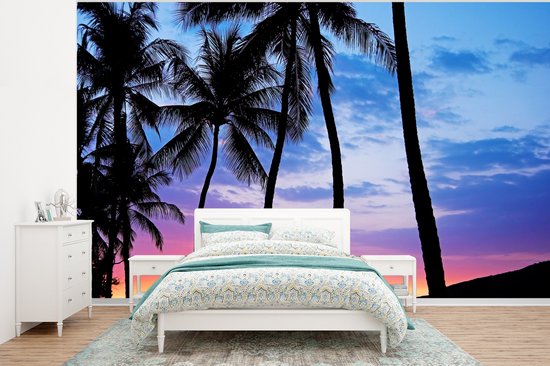Behang - Fotobehang Een silhouet van palmbomen tijdens een zonsondergang op Hawaii - Breedte 400 cm x hoogte 300 cm