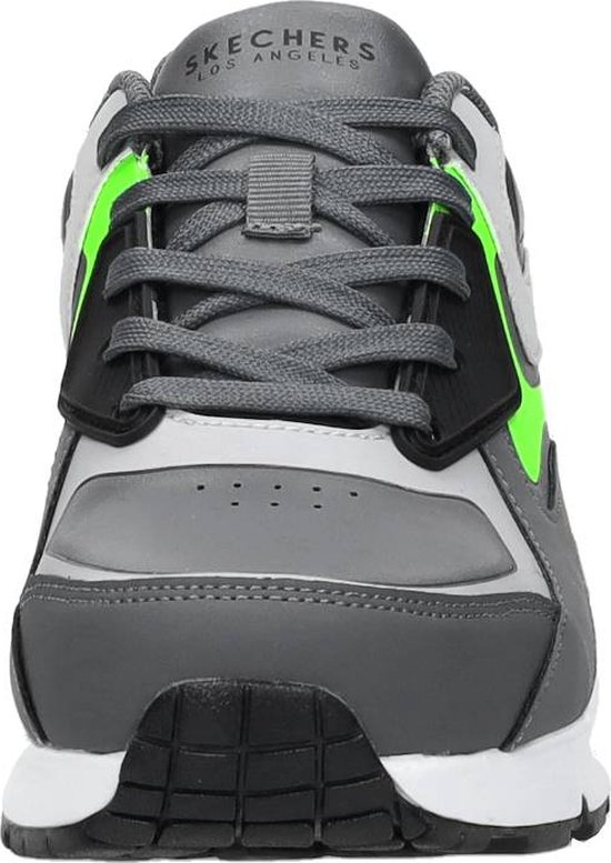 Grijze Skechers sneaker met neon groene accenten en vetersluiting.