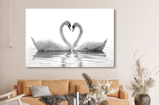 Canvas schilderij 150x100 cm - Wanddecoratie Twee zwanen die samen een hart vormen - zwart wit - Muurdecoratie woonkamer - Slaapkamer decoratie - Kamer accessoires - Schilderijen