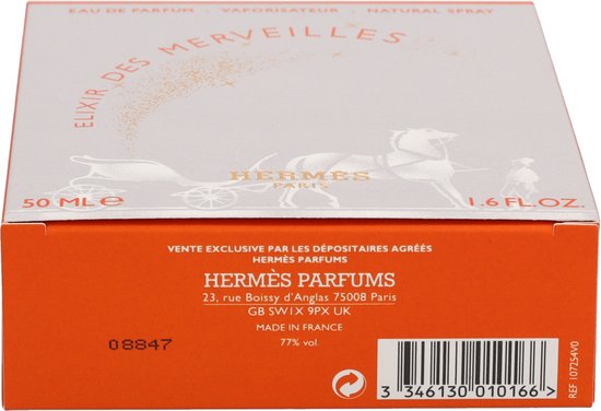 Onderkant van de Elixir des Merveilles eau de parfum doos, met oranje zijkant en informatie over ingrediënten en herkomst.