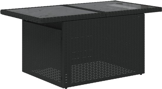 Table basse en rotin noir avec plateau en verre.