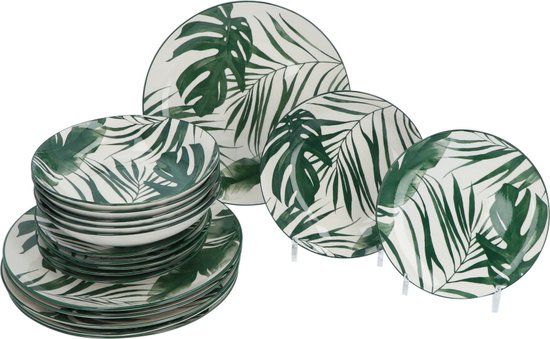 Ensemble d'assiettes et bols blancs imprimés de feuilles de palmier vertes.