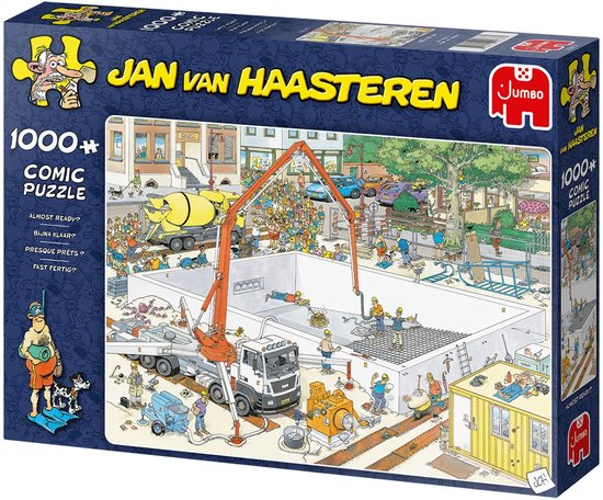 Doos van Jan van Haasteren puzzel "Bijna Klaar?" 1000 stukjes. Een drukke bouwscène met betonmolen, hijskraan en veel bouwvakkers.