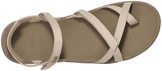 Teva sandalen met beige bandjes en een taupe zool, van bovenaf gezien.