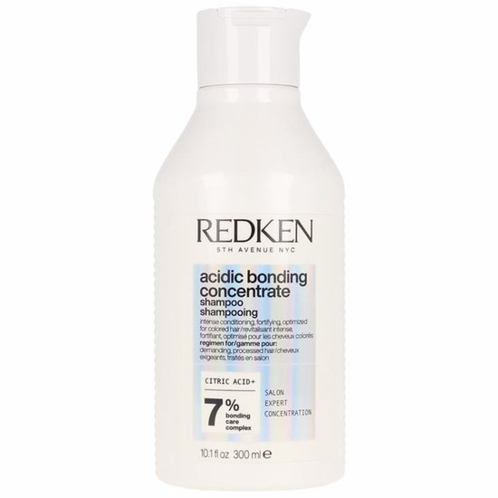 Bouteille blanche de shampooing Redken Acidic Bonding Concentrate avec étiquette holographique.
