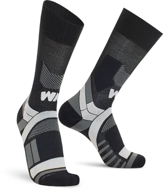 Zwarte Worik compressiesokken met grijze en witte accenten, ondersteunende zones en 'W' logo op de schacht.