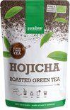 Purasana Hojicha geroosterde groene thee poeder in een zak van 75g. Met "Super Food Tea" logo en aanbevelingen voor gebruik in smoothies, thee, sap of latte.