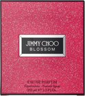 Roze, glinsterende verpakking van Jimmy Choo Blossom Eau de Parfum damesparfum 100 ml.