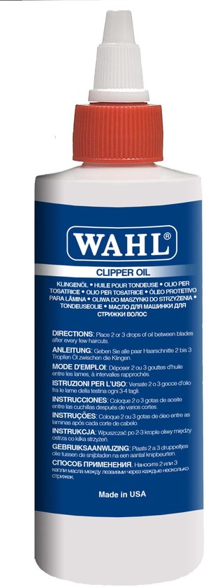 Blauwe fles Wahl tondeuse-olie met rode dop en witte tekst.