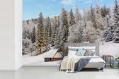 Behang - Fotobehang Houten hutten en dennen in het Nationaal park Tatra in Polen - Breedte 420 cm x hoogte 280 cm