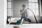 Papier peint photo vinyle - Une femme fait de l'exercice avec deux cordes largeur 390 cm x hauteur 260 cm - Tirage photo sur papier peint (disponible en 7 tailles)