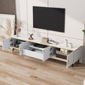 Witte tv-kast met marmerlook blad, open vakken, lade, gouden handgrepen en zwarte poten.